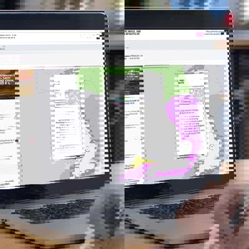 Person viewing OWIC e-learning module on laptop