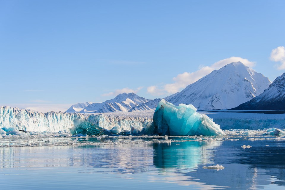 Big Blue Piece Of Ice In Arctic Sea